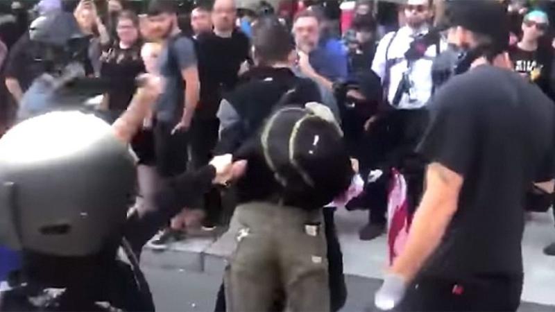 Bernie Sanders supporter protesting right-wing rally with American flag beaten up by Antifa, video shows