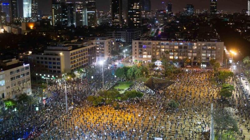 Thousands of Israelis protest against Netanyahu, two meters apart