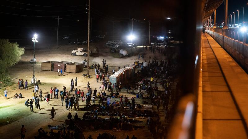 Thousands of Migrants Huddle in Squalid Conditions Under Texas Bridge