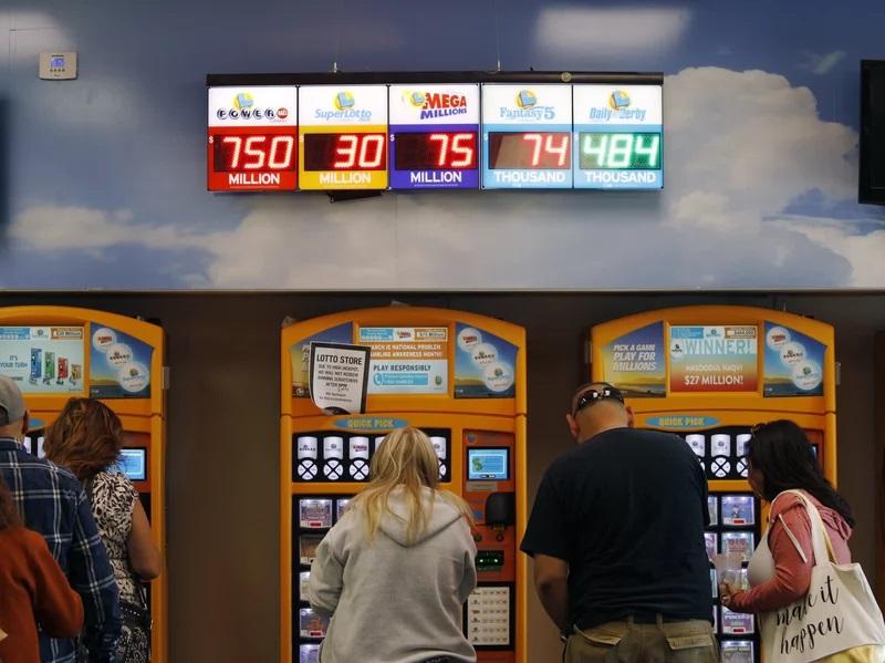 Woman wins $10 million after accidentally pushing the wrong button on lottery machine
