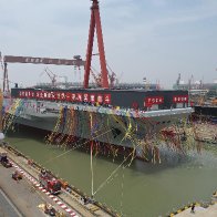 China launches high-tech aircraft carrier in naval milestone | AP News