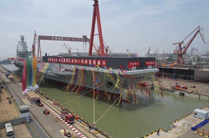 China launches high-tech aircraft carrier in naval milestone | AP News