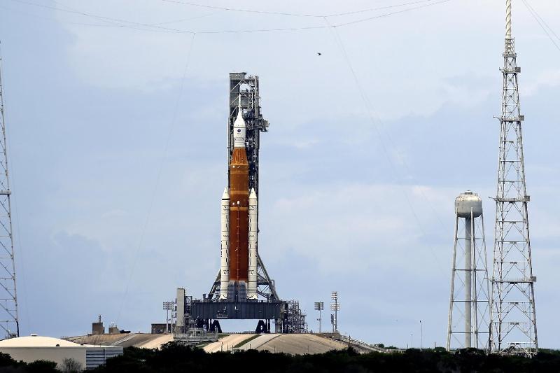 NASA moon rocket on track for launch despite lightning hits | AP News