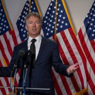 Rand Paul calls for disqualification of a Democratic Senate candidate over past jokes about the Kentucky Republican's broken rib from a violent neighbor