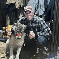 WOLF TORMENT Cruel hunter parades tortured wolf with TAPE around its mouth before taking wounded animal to bar & finally killing it