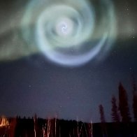 Odd spiral appears amid northern lights in Alaska night sky