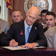 NRA sues Florida over gun bill same day Gov. Scott signed it into law