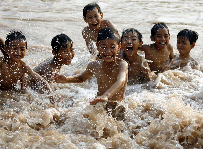 The Simple Joys Of Playing In Water