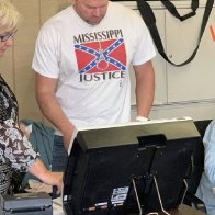 Hospital worker fired after wearing Confederate shirt with noose to polls