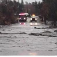 California areas burned by wildfire hit with heavy rain, floods