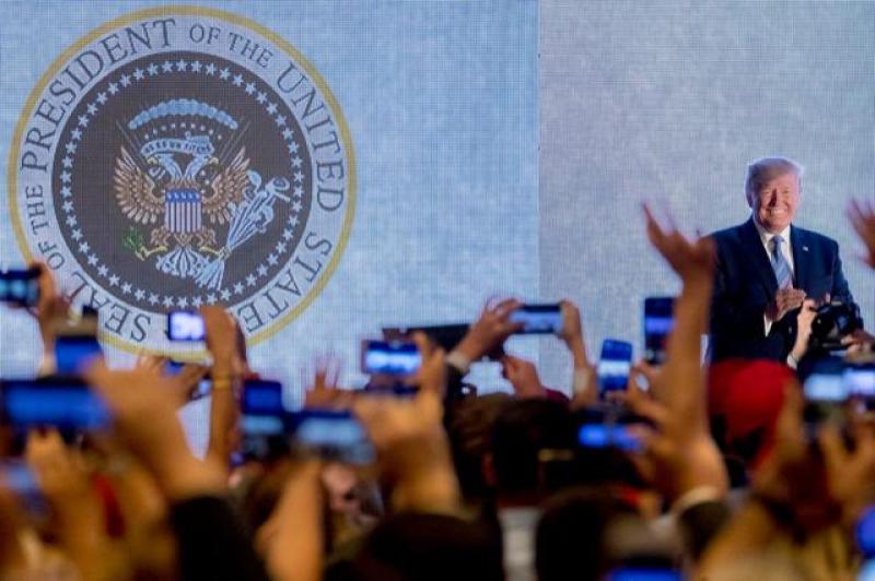Trump appears in front of altered presidential seal saying '45 is a puppet'
