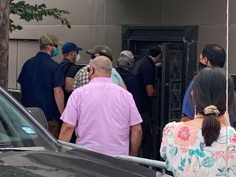 Men seen forcing open backdoor of China's Houston consulate after closure