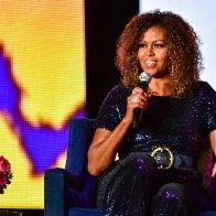 This isn't a game': Michelle Obama rips into Trump for refusing to concede and says he put her family in danger with 'racist lies