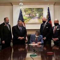 Georgia’s Voter Suppression Bill Signed Into Law While Slave Plantation Painting Hangs In Background