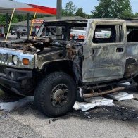 Hummer Erupts in Flames Just Feet From Gas Pump After Stockpiling Fuel in the Trunk