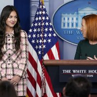 An image shows President Joe Biden touching Olivia Rodrigo’s shoulders during a White House press briefing.