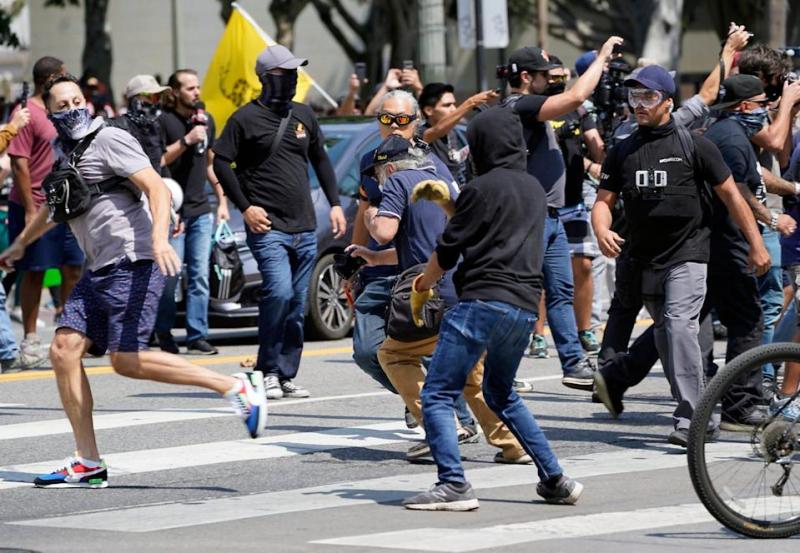 Anti-Vaxxer Videotaped Attacking Journalist At Los Angeles Protest Is Linked To Capitol Riot