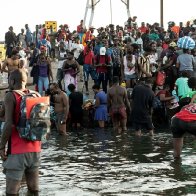 Mass of Migrants Crosses Rio Grande to Enter U.S. Illegally as Border Crisis Worsens