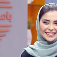 Afghan TV host smiles at the camera even through fear