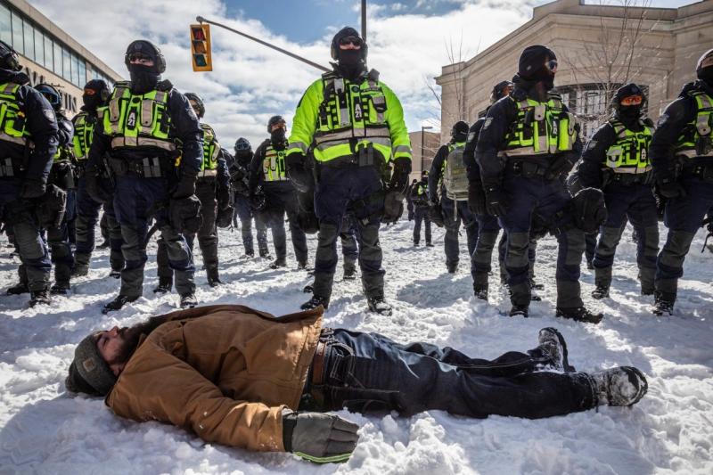 Ottawa Protestor Trampled to death by Officers Standing at Attention.