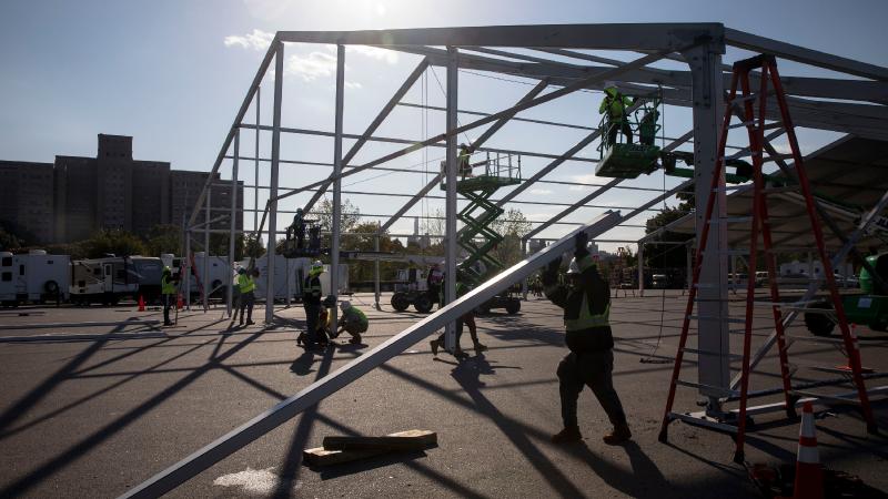 Tents Rise for Migrants in New York City - The New York Times