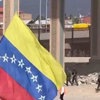 Illegal migrants wave Venezuelan flag after crossing US southern border, attack Border Patrol agents