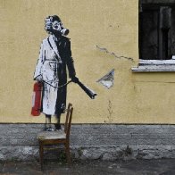 Thieves try to steal Banksy mural from scorched wall in Ukrainian town