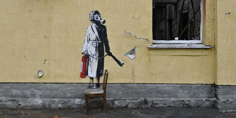 Thieves try to steal Banksy mural from scorched wall in Ukrainian town