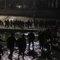 Mass Migrant Crossing Floods Texas Border Facilities