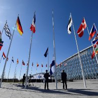 NATO welcomes Finland as a member, raising its flag in a symbol of the power shift spurred by the war.