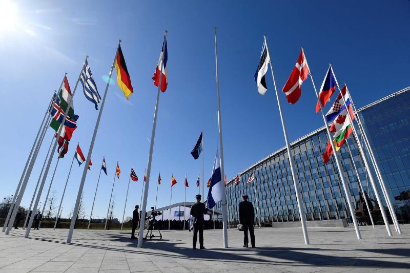 NATO welcomes Finland as a member, raising its flag in a symbol of the power shift spurred by the war.