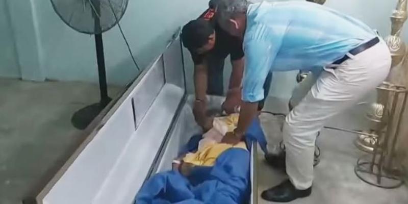 Woman declared dead in Ecuador bangs on coffin during wake