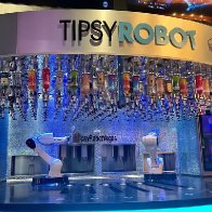 Robots are pouring drinks in Vegas. As AI grows, the city's workers brace for change