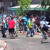 Hundreds of African migrants get into mass brawl, leading to blood-stained streets in Israel 