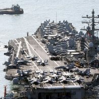 U.S. aircraft carrier arrives in South Korea as North's Kim Jong Un exchanges messages with Putin