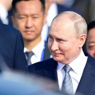 Vladimir Putin arrives in China in rare trip abroad