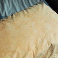 People are divided online over whether it's gross to sleep on stained, yellowing pillows