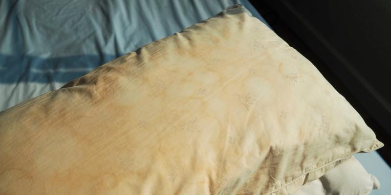 People are divided online over whether it's gross to sleep on stained, yellowing pillows