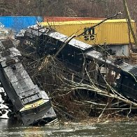 Pa. train derailment leaves cars on riverbank and in water; no injuries or hazardous materials reported