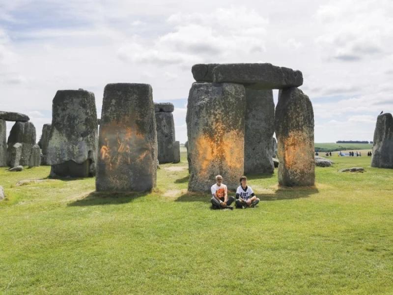 2 climate activists were arrested after spraying orange paint on Stonehenge