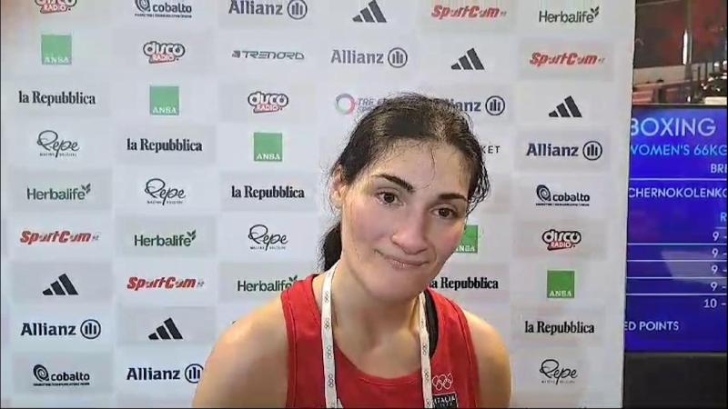 Female boxer yells 'this is unjust' and falls to her knees in tears as she quits fight against 'biologically male' Olympic opponent Imane Khelif after just 46 SECONDS following two powerful punches