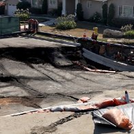 In California city hit by landslides, slipping may not be stoppable