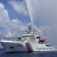 Philippines says China’s coast guard fired water cannons and sideswiped its patrol vessel