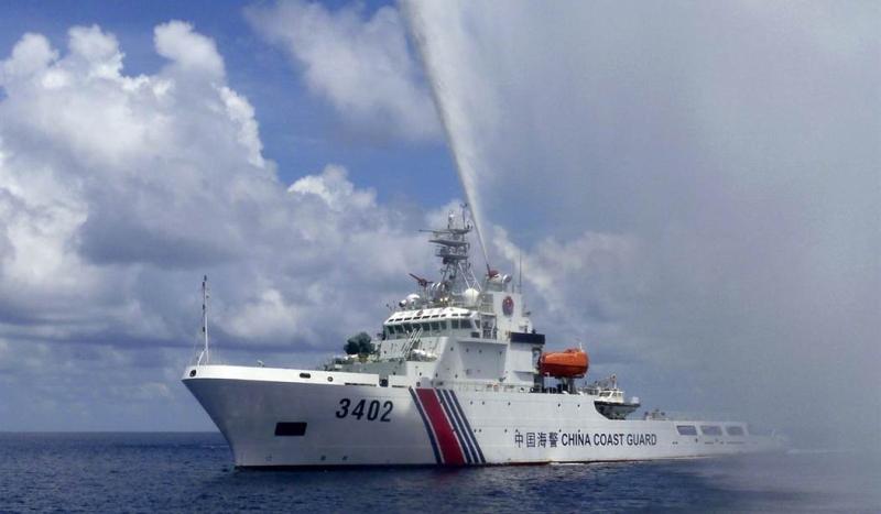 Philippines says China’s coast guard fired water cannons and sideswiped its patrol vessel