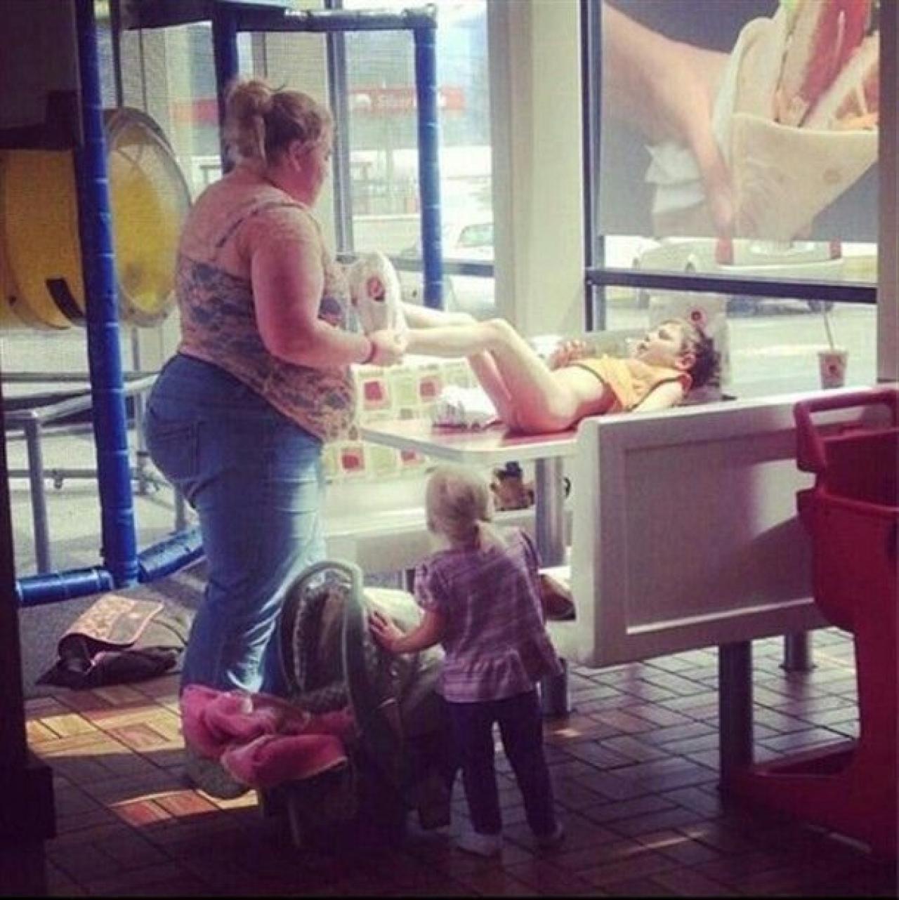 Changing Diaper On Restaurant Table Galler