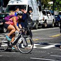 urban-life-new-york-city-female-bicyclist-at-manhattan-intersection-picture-id501478138.jpeg