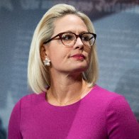 Kyrsten Sinema is reportedly threatening to hold Biden's agenda hostage. She wants to pass the bipartisan roads-and-bridges bill now.