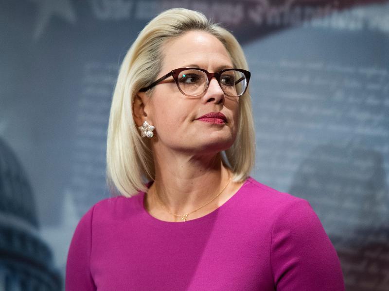 Kyrsten Sinema is reportedly threatening to hold Biden's agenda hostage. She wants to pass the bipartisan roads-and-bridges bill now.