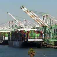 Hundreds of truck drivers wait for dozens of ships to unload their containers in California as the White House announces that it will now work 24 hours a day in an attempt clear the backlog