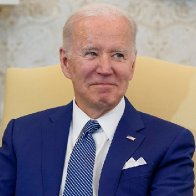 On key issues, a struggling Biden embraces Trump